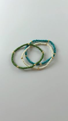 Handmade seed bead bracelet perfect for any occasion! Mini Beaded Bracelets, Casual Turquoise Beaded Bracelets With Tiny Beads, Casual Beaded Bracelet With Gold Beads For Beach, Casual Gold Beaded Bracelets, Beach Bracelets With Gold Round Beads, Gold Beads Bracelets For Beach, Beaded Bracelets For Beach, Colorful Heishi Beads Bracelets, Green Heishi Beaded Colorful Friendship Bracelets