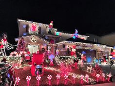 a house covered in christmas lights and decorations