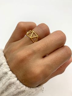 Gold Triangle Ring made of Gold Vermeil: 18k Gold over Solid 925 Sterling Silver ☞ made to last.Matching Earrings & Pendant - please ask me Details: • Minimalist Triangle Ring • Dimensions: Band width ≈ 9mm, thickness ≈ 1mm • 18k Gold Vermeil SKU R1010010335 Minimalist Triangle Jewelry For Anniversary, Modern Midi Rings In Recycled Gold As Gift, Modern Recycled Gold Midi Rings As Gift, Modern Recycled Gold Midi Rings Gift, Gold Triangle Jewelry For Anniversary, Adjustable Geometric Rings As Gift, Unique Geometric Rings For Gifts, Adjustable Geometric Rings For Gifts, Minimalist Geometric Rings For Gifts