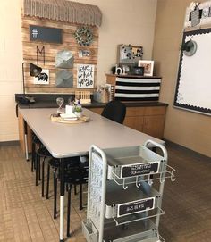 a table with some chairs around it in a room