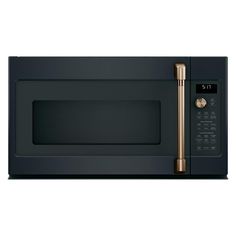 a black microwave with a copper handle on it