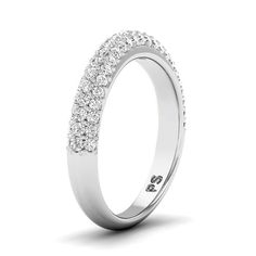 a diamond set wedding ring on a white background