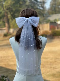 "Material Pearl tulle, alligator clip Description Bow size: 9\" width, 5\" high Tails size: 19\" long Alligator clip size: 3\" Comb size:3\" All custom orders welcome, please contact me! Current processing time is 1-3 business days before shipping. Please contact me with any requests for specific delivery times. SHIPPING: All US orders are shipped USPS First Class Flat mailer with tracking information. Thank you for taking your time to visit Twin craft store. I hope you find something you love f Elegant Wedding Hair Accessories With Ribbon, White Bridal Accessories With Satin Bow For Party, White Bow Fascinator For Wedding, Tulle Headband For Wedding, Wedding Headband With Satin Bow, White Bow Hair Accessories For Party, Wedding Headpiece With Satin Bow Headband, Wedding Tulle Headband, White Satin Bow Hair Accessories For Party