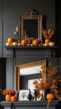 a fireplace with pumpkins and other decorations on it's mantel, in front of a mirror