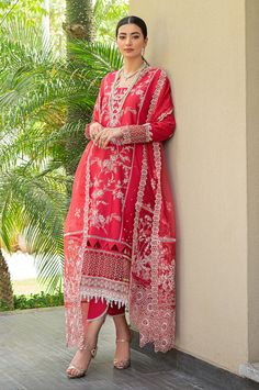 Description: The red embroidered lawn shirt comes with detailed embroidery on the front and sleeves. A matching cotton trouser and embroidered matching organza dupatta finish off the look. Materials: Shirt (Lawn) - Embroidered Front and Sleeves Dupatta (Organza) - Embroidered Organza Dupatta Trouser (Cotton) - Plain Trouser *Disclaimer: Due to the many variations in monitors and browsers, the color of products may appear different on different monitors. **Additional decorative trim has been added to the outfit in the photos. The stitched outfit will not include the additional designer trim. Anarkali Lawn Suit With Sheer Dupatta In Red, Red Unstitched Suit With Dupatta For Eid, Red Anarkali Lawn Suit With Sheer Dupatta, Unstitched Red Suit With Dupatta For Eid, Red Lawn Suit With Sheer Dupatta For Diwali, Red Lawn Suit With Sheer Dupatta For Eid, Festive Red Lawn Suit With Sheer Dupatta, Semi-stitched Red Lawn Suit With Sheer Dupatta, Red Semi-stitched Lawn Suit With Sheer Dupatta