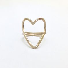 Handmade 'Open Heart' ring designed by Amy Nordstrom exclusively for Collective Hearts.  - 14k gold-filled - Handcrafted in the San Francisco Bay Area - Adjustable, fits size 5.5 to 8  Enclosed with your purchase, you'll find a 100% recycled paper heart, embedded with wildflower seeds. Gift away or plant with the intenti Handmade 14k Gold Heart Jewelry, Unique Handmade Open Heart Jewelry, Unique Hand Forged Heart-shaped Jewelry, Unique Adjustable Heart-shaped Ring, Unique Adjustable Heart Shaped Ring, Unique Adjustable Heart Ring, Gold Sterling Silver Open Heart Ring, Handmade Gold Heart Ring For Promise, Elegant Handmade Heart-shaped Rings