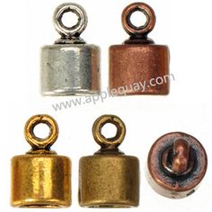 four different types of metal bells with one button on each side and two in the middle