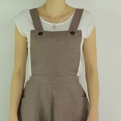 "Handmade coffee dress sleeveless and 2 pockets , perfect for casual wear and suitable for any occasion in any season Details: - 100% natural linen produced in Europe ; - medium weight (180 gram per square meter); - color: coffee, could be any from our colors catalog (color samples at the photo); Made to order, approximately a few days, If you have any questions please message me and I will be glad to answer. Size guide : Size XS Bust: fits bust around 33\"-34\"/ 84-88 cm Waist: fits waist aroun Sleeveless Pinafore Dress For Summer Workwear, Summer Workwear Pinafore Dress, Cotton Sleeveless Pinafore Dress With Adjustable Straps, Brown Linen Dresses With Pockets, Sleeveless Linen Pinafore Dress, Sleeveless Beige Pinafore Dress For Spring, Sleeveless Brown Cotton Pinafore Dress, Brown Sleeveless Cotton Pinafore Dress, Casual Brown Pinafore Dress For Spring