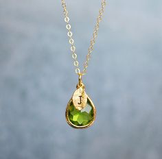 This beautiful simulated peridot necklace would be a perfect gift for a wedding, birthday, anniversary, graduation, or for any occasion. The silver, gold-plated, or rose gold peridot teardrop-shaped pendant is made of glass and shines beautifully in the light. It measures approximately 12.5x16mm and is hung on a 16", 18" or 20" chain. The chain options include silver-plated, gold-plated, rose gold-plated, sterling silver, 14K gold-filled, or 14K rose gold-filled metal. The chains are dainty and Peridot Necklace, 4 Leaves, Birthstone Earring, Leaf Charms, Birthstone Necklace, Delicate Necklace, Gorgeous Earrings, Birthday Anniversary, Necklace Gold