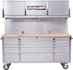 a large metal workbench with drawers and cabinets on the top, in front of a white background