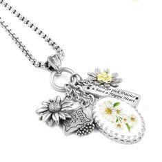 Journey to your Happy Place with the beauty of Daisy Flower Necklace. This Daisy pendant has a 1 inch x 3/4 inch Sterling Silver Daisy charm, a Swarovski Crystal Yellow Daisy and Engraved charm. " I will go Pick Daisies and have a Happy Heart. Adjustable Daisy Necklace handcrafted in timeless stainless steel. Will never turn color or tarnish. Lifetime Warranty. #daisy #stainlesssteel #yellow #Handmade #springfashion #springfashiontrends April Birth Month Flower, Fairytale Bracelet, April Birth Month, Daisy Photo, Winter Bracelet, Crystal Yellow, Locket Earrings, Celtic Bracelet, Autumn Bracelet