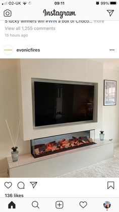 a flat screen tv mounted to the side of a wall next to a fire place