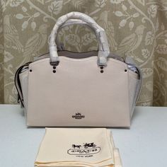 Beautiful Satchel In Gm/Chalk Color With Snakeskin Trim. Lined Interior, Sidewall Pockets. Zip Closure With Hidden Magnetic Sides To Hold Down Zipper. Detachable/Adj 20” Strap. Handle Drop 4.5”. Exterior Has Large Slip Pockets & A Front Zip Pocket. Protective Bottom Feet. Stunning New Satchel With Tags & Care Card. Retail $450 Plus Tax. Luxury Cream Textured Leather Satchel, White Pebbled Leather Top Handle Bag, Cream Textured Leather Satchel Bag, Luxury White Pebbled Leather Bag, White Pebbled Leather Shoulder Bag With Detachable Strap, White Rectangular Pebbled Leather Shoulder Bag, Designer White Satchel With Top Carry Handle, Cream Textured Leather Tote Satchel, White Pebbled Leather Shoulder Bag With Top Handle