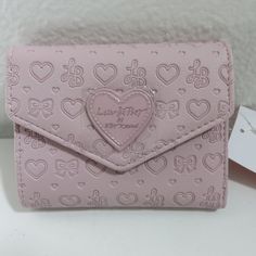 New With Tags Excellent Condition Smoke Free Home Luv Betsey By Betsey Johnson | Blush Pink Heart Embossed Bifold Wallet Heart Pattern Embossed (See Pictures) Bifold Wallet With Snap Closure Light Pink Heart Icon On Side Small Mini Pocket In Flap (See Pictures) 6 Card Slots And Id Pocket Money Pocket With Fabric Lining Measurements: 4.75" X 3.75" Questions? Leave A Comment Below! Fabric Bifold Wallet Pattern Free, Pink Heart-shaped Wallets For Gifts, Feminine Pink Wallets For Daily Use, Pink Heart-shaped Wallet For Gift, Heart-shaped Pink Wallet As Gift, Pink Wallets With Card Slots For Valentine's Day, Pink Heart-shaped Wallets For Valentine's Day, Pink Heart Icon, Light Pink Heart