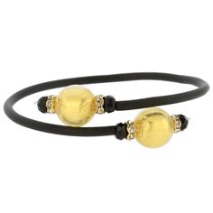 Adorn your wrist with this lovely Murano Glass bracelet - a great reflection of Venice with its trendy present and opulent past. A simple black band connects gorgeous Murano beads in rich colors lined with 24ct gold foil. This Venetian bracelet handcrafted by Murano Glass artisans using ancient glass-making techniques makes a wonderful gift for any style-conscious woman. Each round bead measures just under 1/2 inch in diameter, the connector is rubber-covered wire, which adjusts to a variety of Murano Glass Jewelry, Glass Making, Italian Bags, Handcrafted Artisan Jewelry, Liquid Gold, Glass Bracelet, Elegant Accessories, Rich Colors, Venice Italy