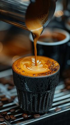 coffee being poured into a cupcake on top of a stovetop with espresso in the background