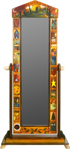 a mirror that is sitting on top of a wooden stand with an animal theme painted on it