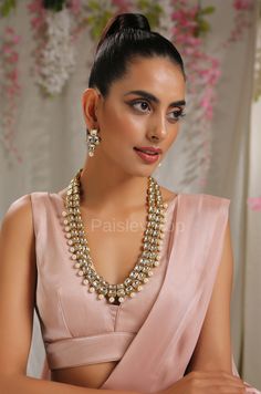 The Kundan and pearls necklace set is inspired by the rich Indian jewelry-making techniques handcrafted by the artisans to celebrate a perfect armor between ancient and modern concepts. The Indian Kundan necklace set is an ode to the beautiful bride as she prepares to begin her new chapter of life. Pair this gorgeous replica of Bollywood jewelry with your ethnic or contemporary ensembles and create a look to remember. Necklace Closure - Adjustable Dori Earrings Closure - Push Back Style Tip - Th Elegant Pearl Pendant Temple Necklace For Celebration, Elegant Hand Set Pearl Necklace For Ceremonial Occasions, Elegant Hand Set Pearl Necklace For Ceremonial, Elegant Ceremonial Jewelry Sets With Matching Earrings, Elegant Hand-set Pearl Necklace For Ceremonial Occasions, Elegant Temple Necklace With Matching Earrings, Elegant Temple Necklace With Pearl Pendant For Wedding, Elegant Ceremonial Pearl Jewelry, Festive Jeweled Temple Necklace