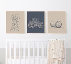 three framed pictures hang on the wall above a crib