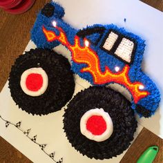 a cake made to look like a monster truck with flames on the front and sides