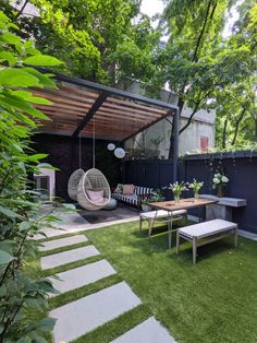 an outdoor living area with grass and plants