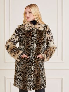 Faux fur coat. Classic collar. Long sleeves. Front button fastening. Regular fit. FABRIC DETAILS: Animalier print. Front pockets. Picture shows size 40. Total lenght: 92 cm / 36.22 inch. Sleeve lenght: 62,5 cm / 24.61 inch. SHELL (main fabric): 38% Acrylic, 37% Modacrylic, 25% Polyester; LINING: 100% Polyester; SLEEVES AND COLLAR: 53% Modacrylic, 27% Acrylic, 20% Polyester. WASH LABEL: Dry clean. This item for safety for the store cut in half or marked with black marker the labels to avoid retur Fall Leopard Print Fur Coat With Faux Fur Lining, Trendy Long Coat With Faux Fur Lining, Trendy Long Fur Coat With Faux Fur Lining, Luxury Long Sleeve Leopard Print Outerwear, Fitted Leopard Print Faux Fur Outerwear, Fitted Faux Fur Outerwear In Leopard Print, Fitted Long Fur Coat For Winter, Fall Leopard Print Outerwear With Faux Fur Trim, Trendy Long Faux Fur Coat