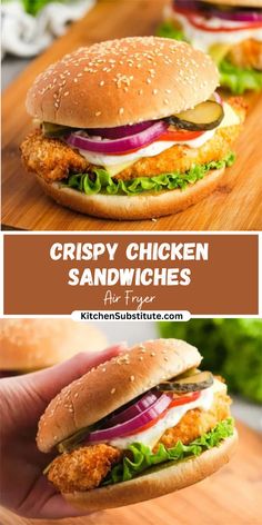 crispy chicken sandwich sandwiches with lettuce, tomato and onion on a wooden cutting board