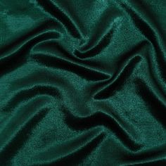 a dark green velvet fabric with very thin lines on the top and bottom of it