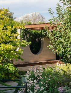 a bench sitting in the middle of a garden