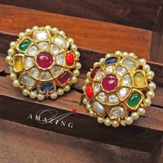 Navratna Stone Earring |Semi Precious Navaratna with Fresh Water Sea Pearls Earring | Moissanite Polki Earring | Indian Wedding Jewelry | Material : Silver Gemstone: Moissanite, Semi Precious Navratna Stones and Fresh Water Sea Pearls Stone colour: Uncut Polki Primary colour: Gold Size-Length: 30mm Width: 30mm Closure : Screw back and Clips Silver Intricate, hand crafted, Pure Silver Polki Earrings, studded with high quality Multi Semi Precious Navratna Stone with Fresh Water Sea Pearls Earring Navratna Jewellery, Navaratna Jewellery, Indian Traditional Wedding, Earring Indian, Traditional Wedding Jewellery, Wardrobe Interior, Wedding Jewelry Sets Bridal Jewellery, Polki Earrings, Wedding Jewelry Set