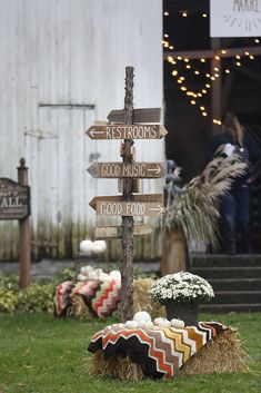 a wooden sign that says restaurants good music good food on it sitting in the grass