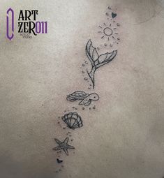 the back of a woman's stomach with an ocean scene and starfish on it