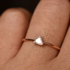 "This minimal trillion cut natural diamond ring is a dream! Simple yet unique, it speaks larger than words! This lovely proposal ring is shaped like a mountain is a thoughtful ring for all hiking and nature lovers! Featuring a 0.15ct trillion diamond handset in a dainty 3 prong setting, it is crafted in 14k solid rose gold and is ready to ship! * Gemstone : Natural Diamond * Diamond Wt. : 0.15 Ct * Color-Clarity : H-I, Vs * Shape : Trillion * Gold : 14k Solid Yellow Gold * Gold Weight : ~0.90 gm Trillion Cut Ethical Diamond Ring In Rose Gold, Rose Gold Diamond Rings With Trillion Cut, Minimalist Trillion Cut Wedding Rings, Minimalist Rose Gold Wedding Ring With Rose Cut Diamonds, White Trillion Cut Diamond Ring Gift, 14k Gold Trillion Cut Rose Cut Diamond Rings, Trillion Cut White Diamond Ring Gift, 14k Gold Rings With Rose Cut Trillion Diamonds, Minimalist Trillion Cut Diamond Ring