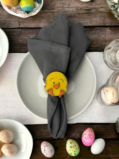 an easter table setting with eggs and napkins