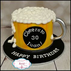 a birthday cake that is shaped like a beer mug