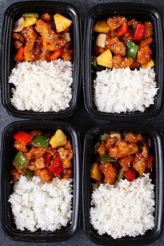 four black plastic containers filled with rice and chicken on top of each other in them