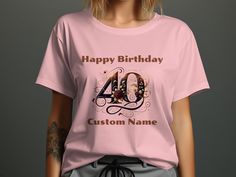 a woman wearing a pink birthday shirt with the number forty four printed on her chest