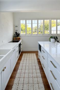 Grid Jute Mat and Hallway Runners - White with a Natural Grid Pattern Sustainable fibres like jute are the perfect hardwearing mat for your kitchen or entry way. With a natural look and eco-friendly materials, these jute mats add texture and interest to your home. So versatile they can be used at your front door, in the kitchen or hallways. Jute hallway runners available in many lengths ready to ship. They are handmade on a loom and are ethically made with no forced or child labor, earning GoodWeave approval! Perfect for high traffic areas. *Also available in the reverse pattern - natural with white grid lines. Sizes Available: - 60 x 90 cm - 70 x 140 cm- 80 x 300 cm - 80 x 400 cm SPECIFICATIONS: - Jute - Available in multiple sizes - GoodWeave certified *Each rug is hand made, meaning no Apartment Hallway Runner, White Kitchen Floor, Jute Mats, Long Kitchen, White Runners, Kitchen Sideboard, Grid Pattern, White Floors, Hallway Runner