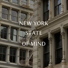 the words new york state of mind are in front of an old building with balconies