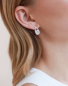 A modern take on your classic stud, you'll never want to take off our Marlowe CZ Teardrop Earrings. Made with cubic zirconia in an open pave teardrop surrounding an oval stone. These studs sparkle like real diamonds. Sterling silver plated Cubic zirconia 0.75" length; .25" width Hypoallergenic, lead-free & nickel-free Style #4351 Teardrop Bridal Earrings, Freshwater Pearl Drop Earrings, Studs Gold, Knot Stud Earrings, Rose Gold Studs, Jewelry Website, Opal Studs, Circle Studs, Cz Stud Earrings