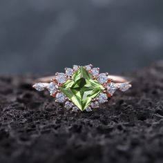 ► FEATURES: Center Stone: 1.3 Carats Beautiful Peridot gemstone, 6mm Princess Cut Side Stone: 0.45 carats 5A Moissanite Shank Width (Bottom): 1.6-1.7mm The stones of the ring can be replaced with other different kinds of gemstone such as morganite, aquamarine, amethyst, citrine, white CZ, opal, moissanite, alexandrite, moss agate, etc. If you want to customize your own personal ring, please feel free to contact me. ► PROCESSING & SHIPPING Processing time: 3-4 weeks after placing order, Internati Luxury Peridot Ring For Anniversary, Luxury Elegant Peridot Rings, Peridot Engagement Ring, Peridot Engagement Rings, Engagement Ring Unique, Wedding Promises, Peridot Ring, Peridot Gemstone, Ring Unique