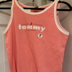 Nwt Tommy Hilfiger Girls Size Xl Coral Tank. Comes From A Pet And Smoke Free Home. Communication Through Poshmark Only. Retails $16.00 90s Style Letter Print Tank Top For Spring, 90s Style Tank Top With Letter Print For Spring, 90s Style Spring Tank Top With Letter Print, Trendy Pink Tank Top For Streetwear, Casual Pink Tank Top With Letter Print, Casual Pink Letter Print Tank Top, Pink 90s Style Spring Tops, Pink Sleeveless Top For Streetwear, Casual Pink Sleeveless T-shirt