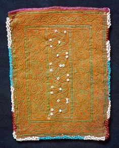 This is a beautiful Pashtun silk embroidered pouch in a wonderful green hue from the Paktia province, Afghanistan.  It is surrounded by blue glass beads.  The workmanship is of very high quality and hand done.  -Natural colors-High quality workmanship Traditional Green Beaded Bag, Traditional Green Beaded Bags, Green Embroidered Fabric For Ceremonial Occasions, Ceremonial Green Embroidered Fabric With Intricate Designs, Ceremonial Green Embroidered Fabric, Ceremonial Green Intricate Embroidered Fabric, Embroidered Pouch, Face Photo, Silk Embroidery