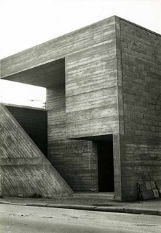 an old black and white photo of a building with two large steps leading up to it