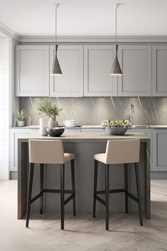 an image of a kitchen setting with bar stools