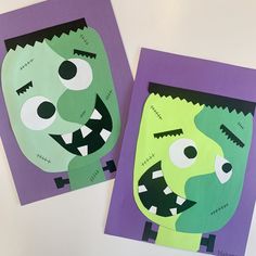 two paper plates with cut out monsters on them, one is green and the other is purple