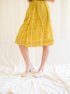 Introducing our beautiful ditsy colorful floral print vintage dress. This yellow color base dress is perfect for any occasion and is sure to turn heads. Made from soft and lightweight chiffon fabric, this dress is designed to keep you comfortable all day long. The sleeveless style and piping design neckline add a touch of elegance to the dress. This dress is perfect for those who are looking for sustainable fashion options. As a pre-loved piece, it is not only environmentally friendly but also t Spring Rayon Floral Dress, Yellow Floral Print Spring Dress, Spring Yellow Floral Print Dress, Yellow Floral Print Dress For Spring, Spring Vintage Floral Dress For Brunch, Yellow Floral Dress For Spring, Yellow Floral Dress For Spring And Summer, Yellow Floral Dress For Garden Party, Spring Floral Yellow Dress For Brunch