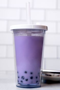 a purple drink sitting on top of a counter