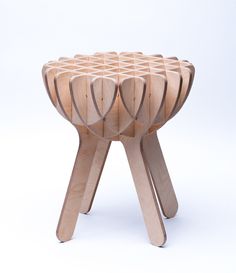 a stool made out of wooden sticks on a white background