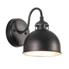 an outdoor wall light with a black metal shade on it's side and a white background